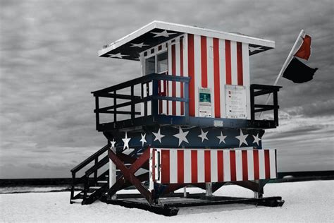 Red And Blue Striped Shed On Sand · Free Stock Photo