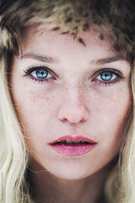Portrait Of A Beautiful Young Woman With Freckles And Blue Eyes By Stocksy Contributor Jovana