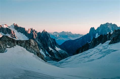 Photo Of Snow Capped Mountains During Dawn · Free Stock Photo