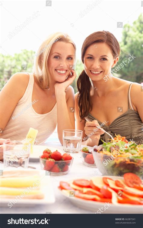 Young Women Eating Outdoors Stock Photo 66387241 Shutterstock