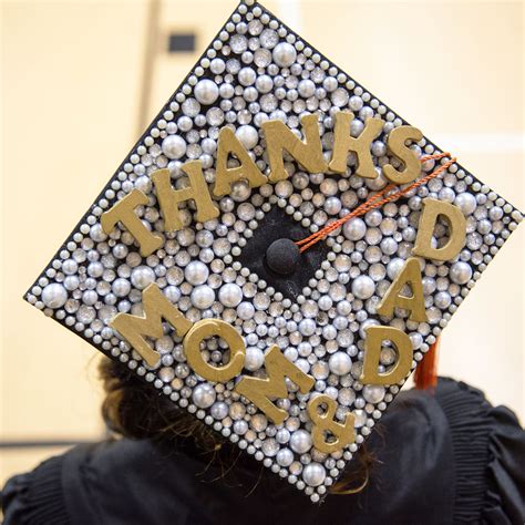 Students Decorate their UCF Graduation Caps for a Good Cause