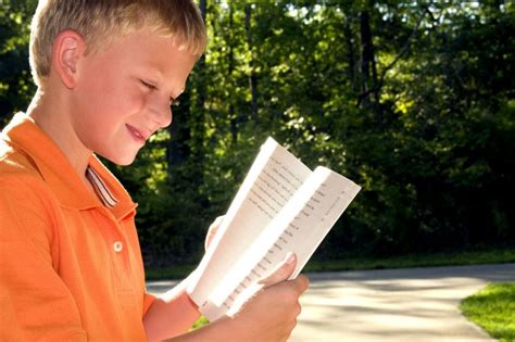 Free Picture Boy Photographed Reading Book Outdoors Setting