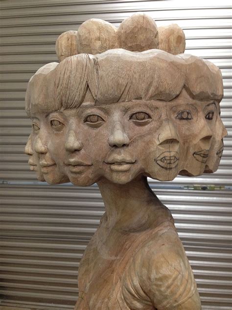 Japanese Artist Turns Wood Into Twelve Faced Girl And Other Weird