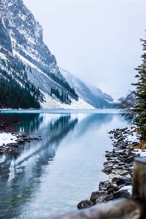 Royalty Free Photo Calm Body Of Water Near Snow Filled Mountains