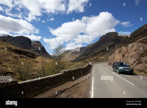 Car On The A82 Road Through Glencoe Highlands Scotland Uk Stock Photo