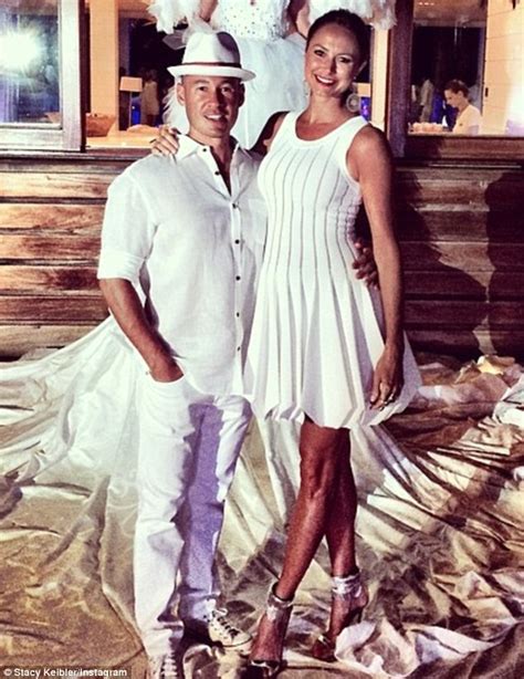 pregnant stacy keibler poses in tight dress and silver stilettos with new husband jared pobre