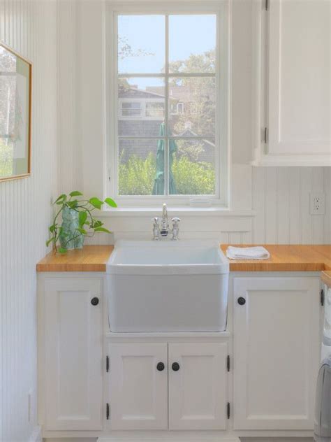 Also, the perfect farmhouse sink is in a trough shape and is designed with copper hardware. Beach House laundry room sink mimics the farmhouse sink in ...