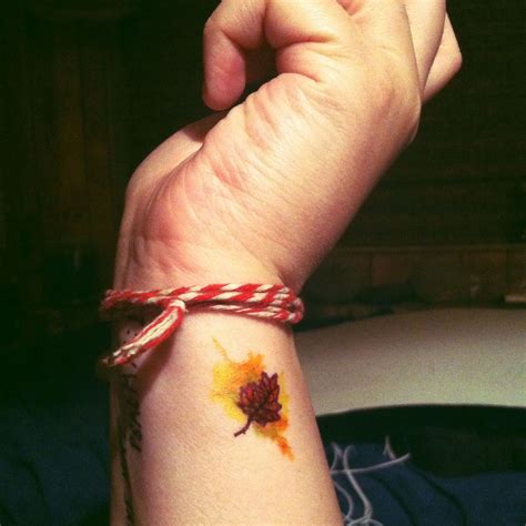 Tiny Autumn Leaf With Watercolor Explosion Tattoo Mini Tattoos