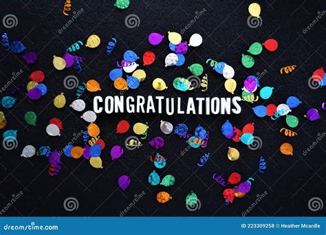 Word Congratulations With Shiny Balloon Glitter Against Black
