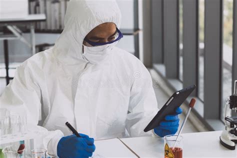 Lab Technician In Personal Protective Equipment Ppe Suit Vaccines