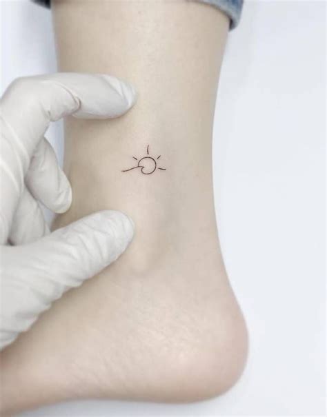 Minimalist Sun And Wave Tattoo On The Ankle Uniquetattoos