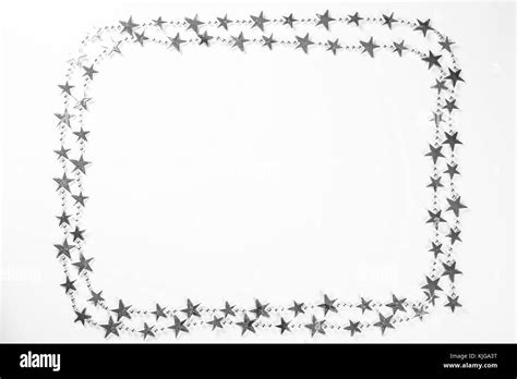 Christmas Frame With Silver Stars Decorations On White Background
