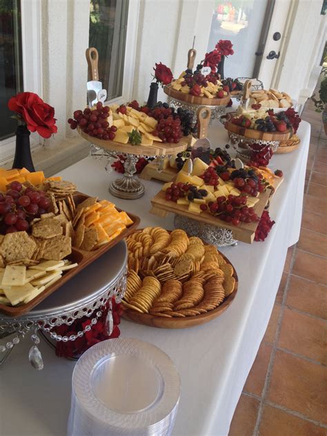 Cheese And Cracker Display Wedding Appetizers Red Flowers Buffet