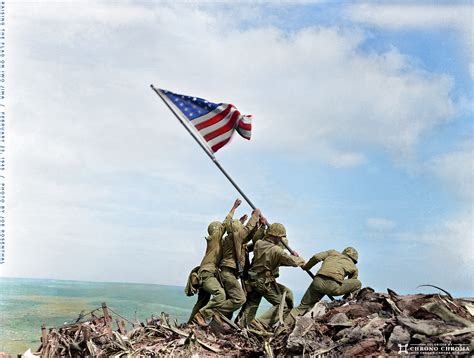Us Marines Raise A Us Flag On Top Of Mount Suribachi During The Battle