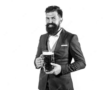 premium photo funny bearded man in classical suit holding glass with beer in hand smiling man