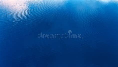 Blue Water Texture On The Surface Of A Clear Blue Lake Stock Photo