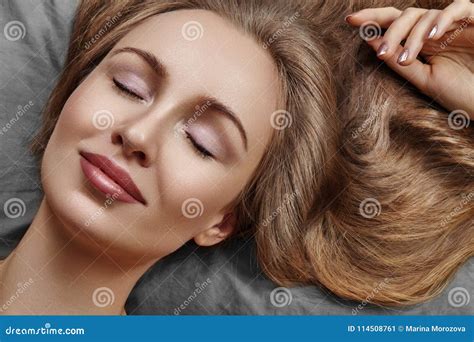 Beautiful Woman Sleeping While Lying In Bed With Comfort Sweet Dreams Model With Curly Hair