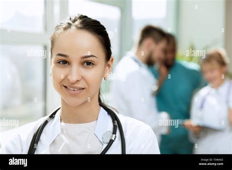 Healthcare People Group Professional Female Doctor Posing At Hospital