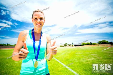 Portrait Of Female Athlete Showing Thumbs Up Stock Photo Picture And Low Budget Royalty Free