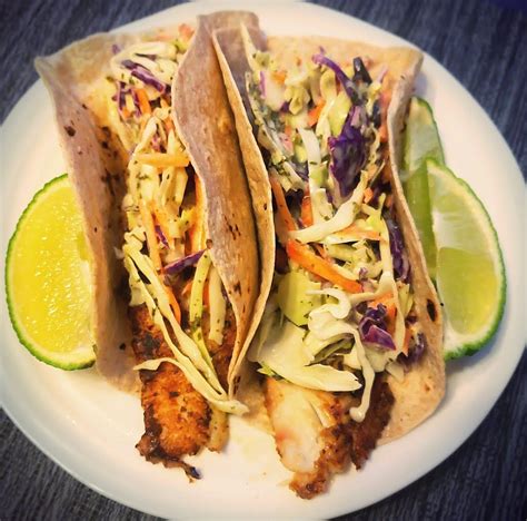 The bulk of the slaw is thinly sliced cabbage and jalapenos. Blackened Fish Tacos | Cilantro lime slaw, Blackened fish ...
