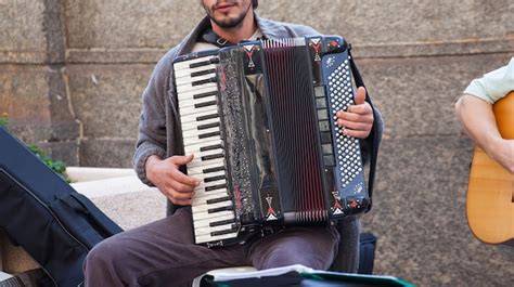 Premium Photo Street Musician Playing Accordion
