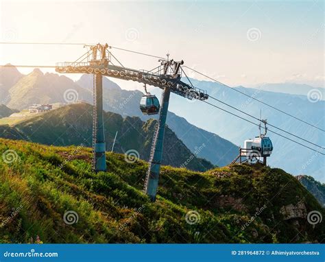 Cable Car In The Mountains At Sunset In Summer Cabins Arrive At Rosa Peak In Krasnaya Polyana
