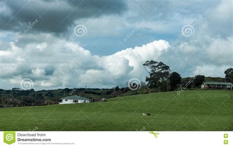 House In A Meadow Under Cloudy Skies Stock Image Image Of Clouds