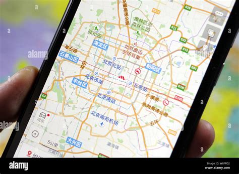 A Chinese Man Uses The Baidu Map App On His Smartphone In Jinan City
