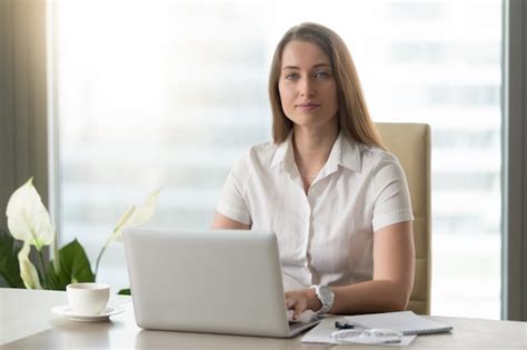 Free Photo Female Office Worker Doing Daily Work On Laptop