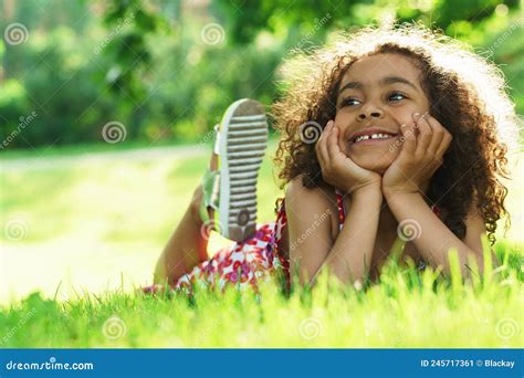 Cute Black Girl Lying On A Grass In A City Park Stock Image Image Of Walk Candid 245717361