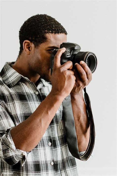 Download Premium Image Of Male Photographer Holding A Camera 1224224