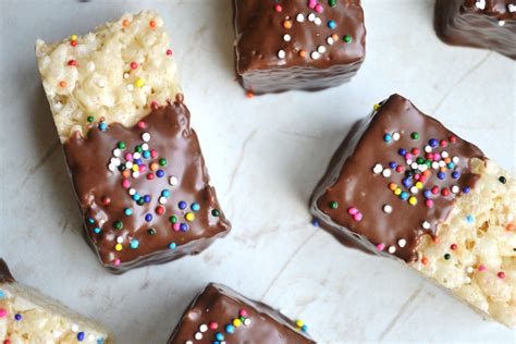 Rice Krispie Treats Are Dipped In Chocolaty And Then Decorated With