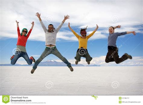 Happy Friends Jumping Outdoor Stock Image Image Of Blue Colored