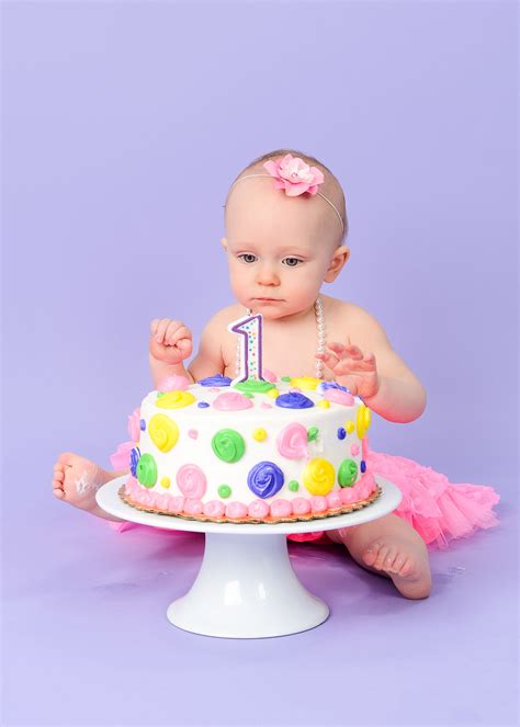 Cake smash photo sessions take place at my randolph portrait studio and include classic and beautiful setups and styling options. cake smash photography near me little girl on purple with ...
