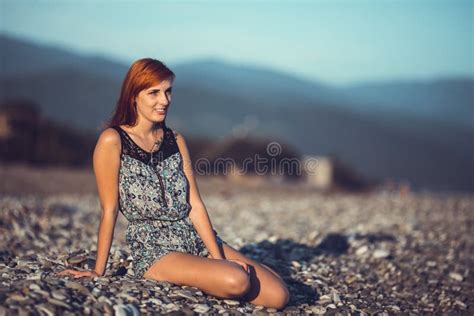 Beautiful Young Woman Enjoing Herself On Pebble Sunny Beach Stock Image