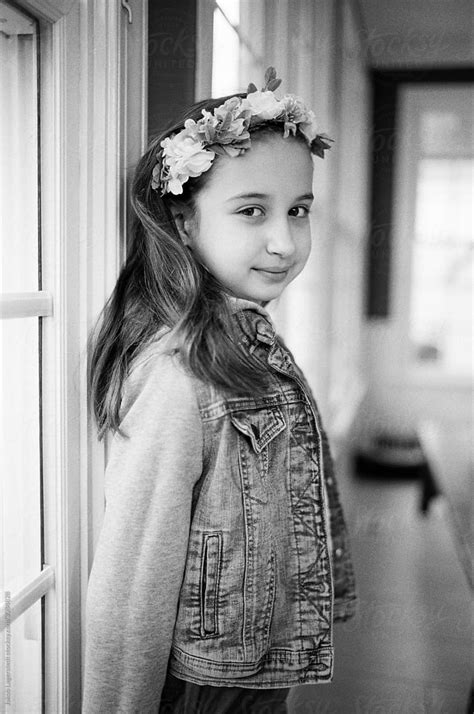 Black And White Portrait Of A Young Girl Wearing Flowers In Her Hair