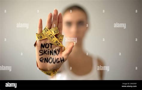 Not Skinny Enough Written On Woman Palm With Tape Severe Diet
