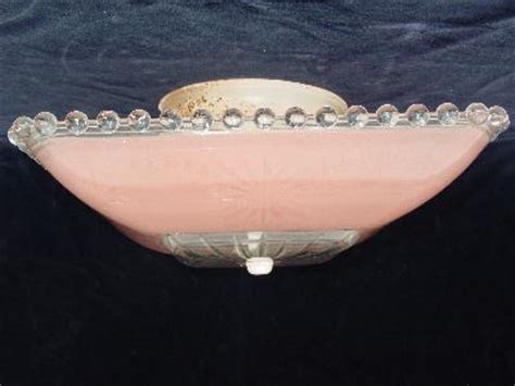 I am sure it looks lovely with light coming through it. 1940's vintage pressed glass ceiling light pink shade