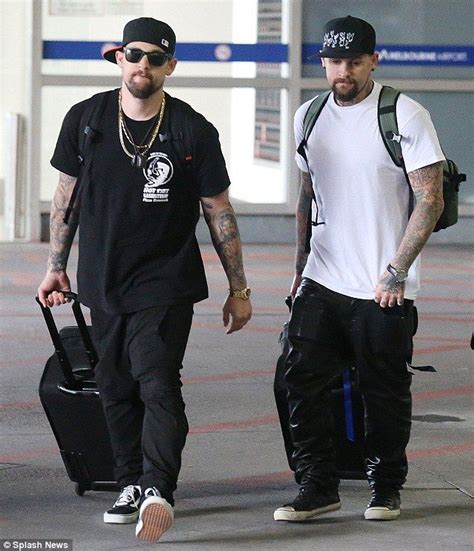 twin time joel l and benji madden r at melbourne airport on wednesday without their f