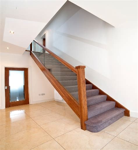 Stair widths are based on the use and occupancy loads of adjacent spaces and must be serviced with handrails on one or both sides depending on the stair width. Walnut Clear Glass Stairs walnutclearg - Stairs Ireland