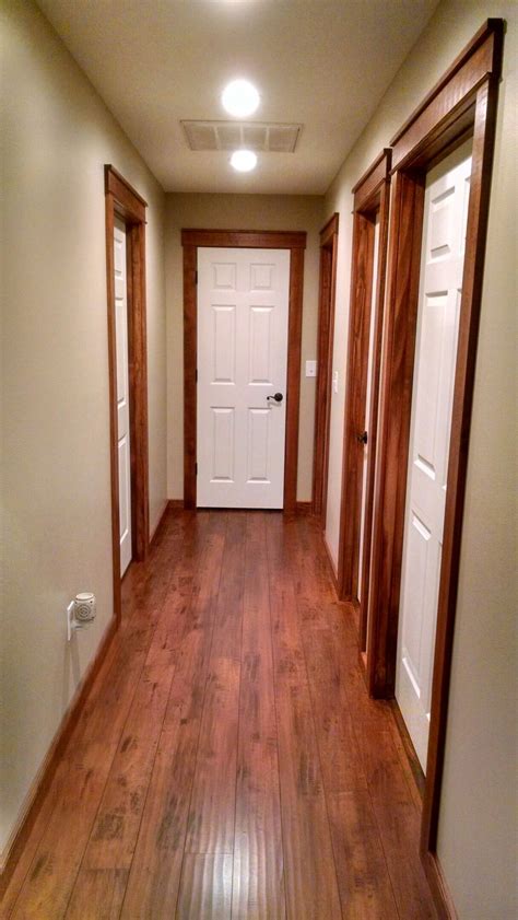 Priming and painting our trim and doors with a paint sprayer | young house love. White painted doors with stained wood trim.... Rustic cozy ...