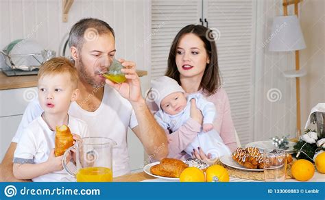 Happy Mother Father And Son Having Breakfast At Home Stock Image Image Of Girl Happy 133000883