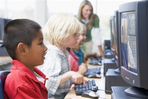 Kindergarten Children Learning To Use Computer Stock Photo Image Of