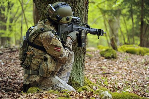A Latvian Soldier Takes Cover During Exercise Saber Junction 15 At The
