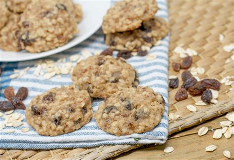 Oatmeal Raisin Cookies With Raisins On A Blue And White Towel