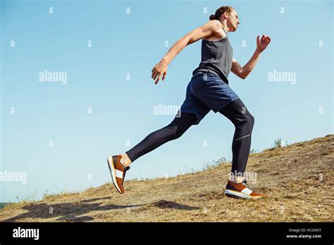 Running Sport Man Runner Sprinting Outdoor In Scenic Nature Fit