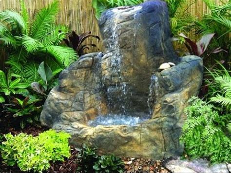 It is designed to seem like an underwater cave with its sea shell decorations and greenish color. Massive koi pond with huge grotto waterfall cave - YouTube