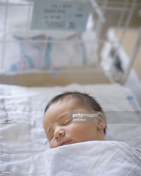 Newborn Baby Boy Sleeping In Hospital Bassinet High Res Stock Photo