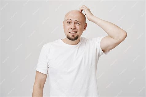 Free Photo Confused Bald Middle Aged Guy Scratgh Head Puzzled