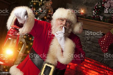 Pictures Of Real Santa Claus With Fingers On Lips Stock Photo